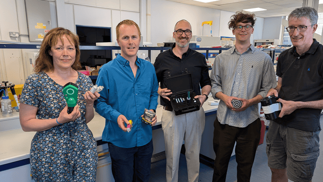 Dr Jenny Scott, University of Bristol and colleagues from Team Harm Reduction led by Professor Chris Pudney, University of Bath hold the new handheld devices.